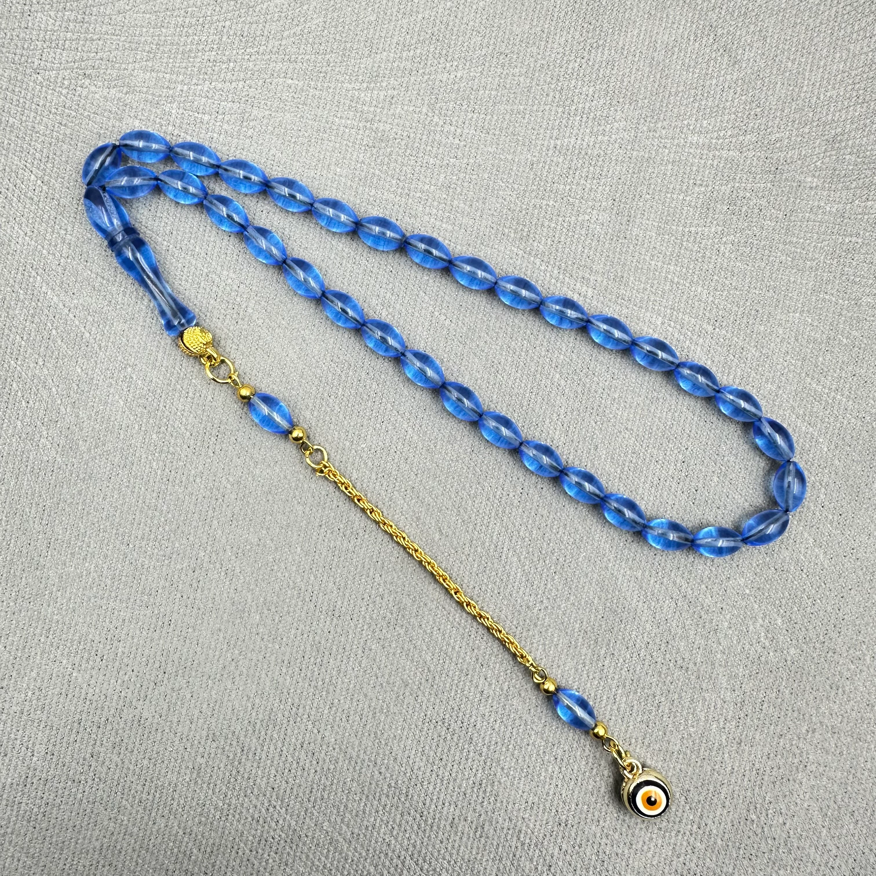 Pirinç Püsküllü Nazar Boncuğu Detaylı Bilek Boy Mavi Uçak Camı Tespih